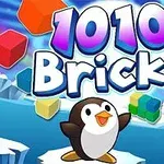 Tučňák stojí na zasněžené krajině s nápisem 1010 Bricks a barevnými kostkami v pozadí