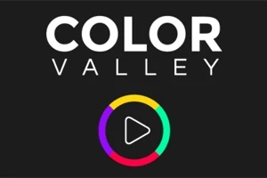 Nápis „COLOR VALLEY“ na černém pozadí s barevným kruhem a symbolem přehrávání uprostřed