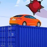Oranžové auto na modrém kontejneru s obrovskou ostnatou koulí visící nad ním