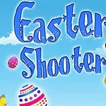 Velký modrý nápis Easter Shooter s velikonočními vajíčky a motýly na modrém pozadí s mráčky