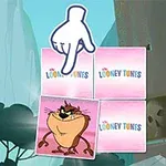 Kreslená ruka ukazuje na kartu se zvířetem vedle tří karet s logem Looney Tunes, v kreslené krajině s útesy a stromy