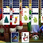 Kartová hra s vánočními motivy na pozadí s postavami Santa Clause a vánočního stromku
