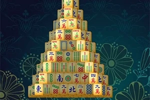 Pyramida z mahjongových kamenů s různými symboly na tmavém pozadí s květinovým vzorem