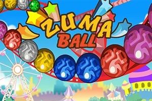 Barevné koule na dráze s nápisem Zuma Ball na světle modrém pozadí s kolotočem a věžemi